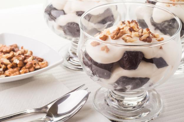 Dessert with prune, walnuts and whipped cream