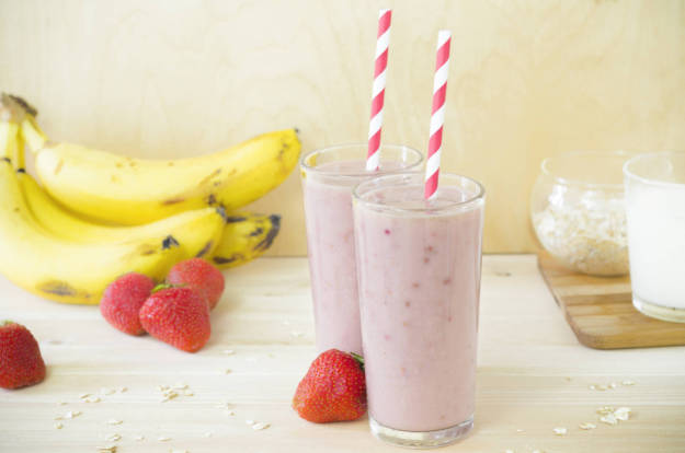 Milk shake with banana, strawberry and oatmeal, healthy breakfast. Useful smoothies