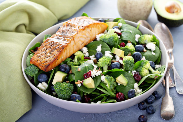 Fresh spinach and feta salad with blueberries, and broccoli, and salmon